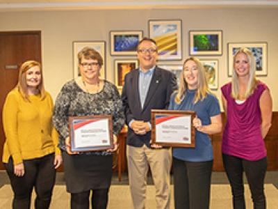 Public Information Officer/Communications Manager Steve Hawley (center) with Communication Specialists