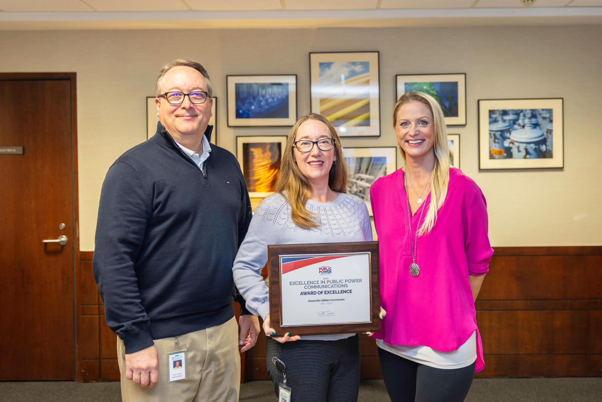 group of three holds award