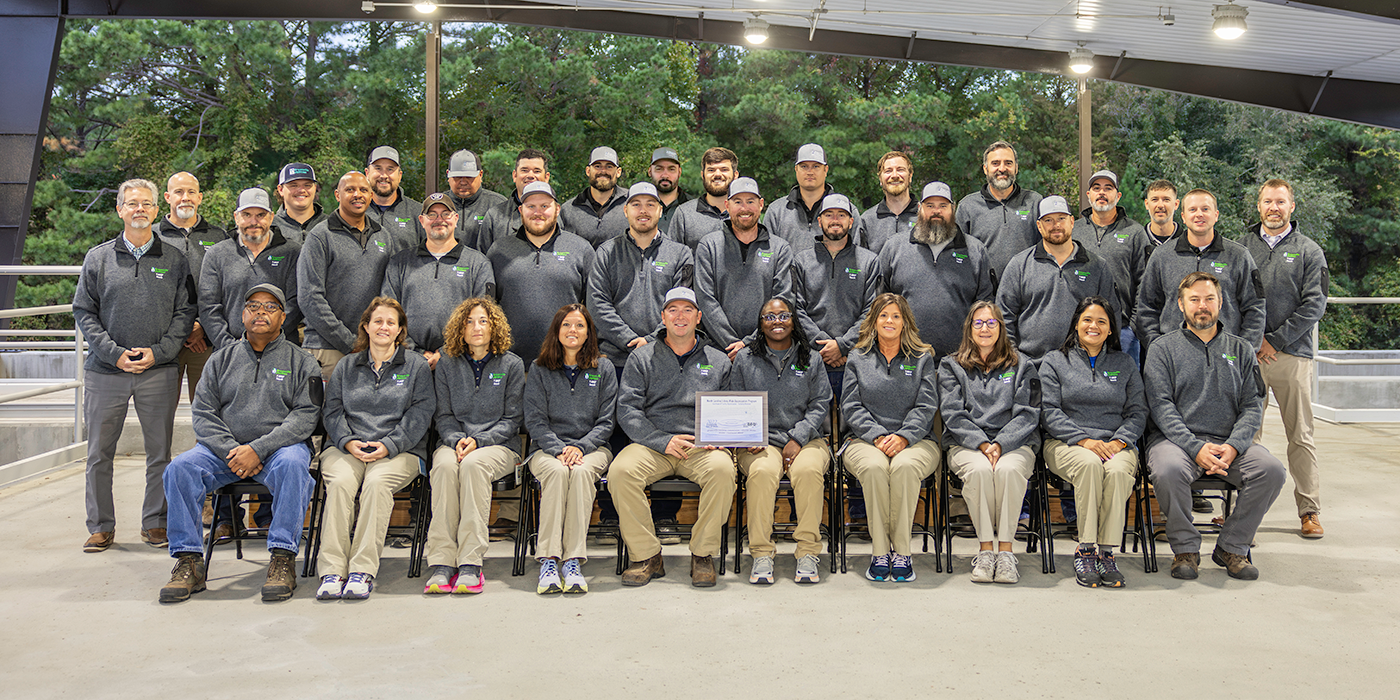 Water Resources Staff pose for photo with award