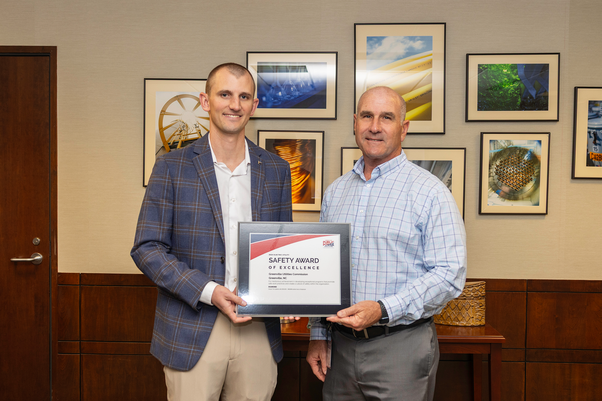 Jacob Swink and Ken Wade hold APPA recognition.