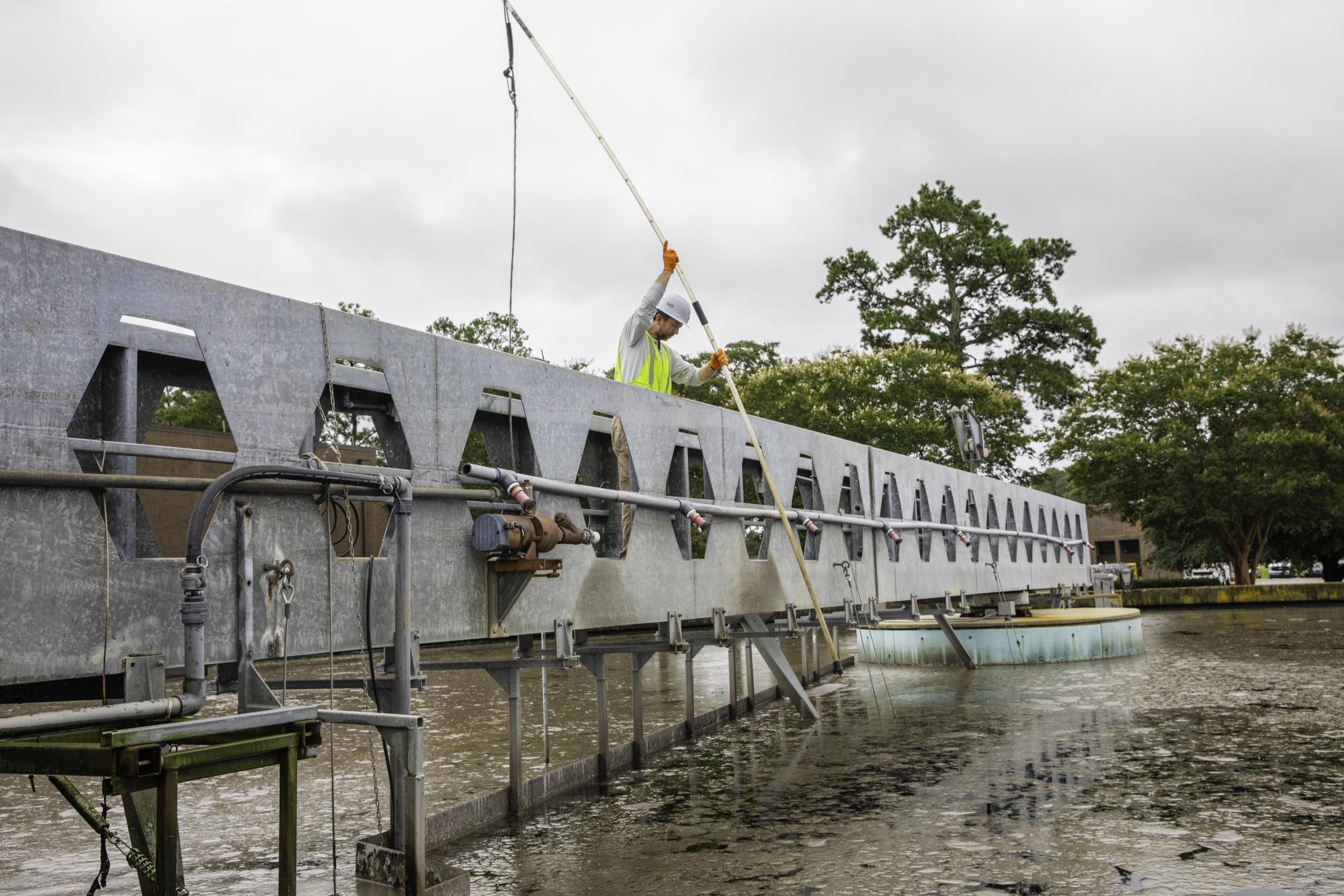 Wastewater operator tests water