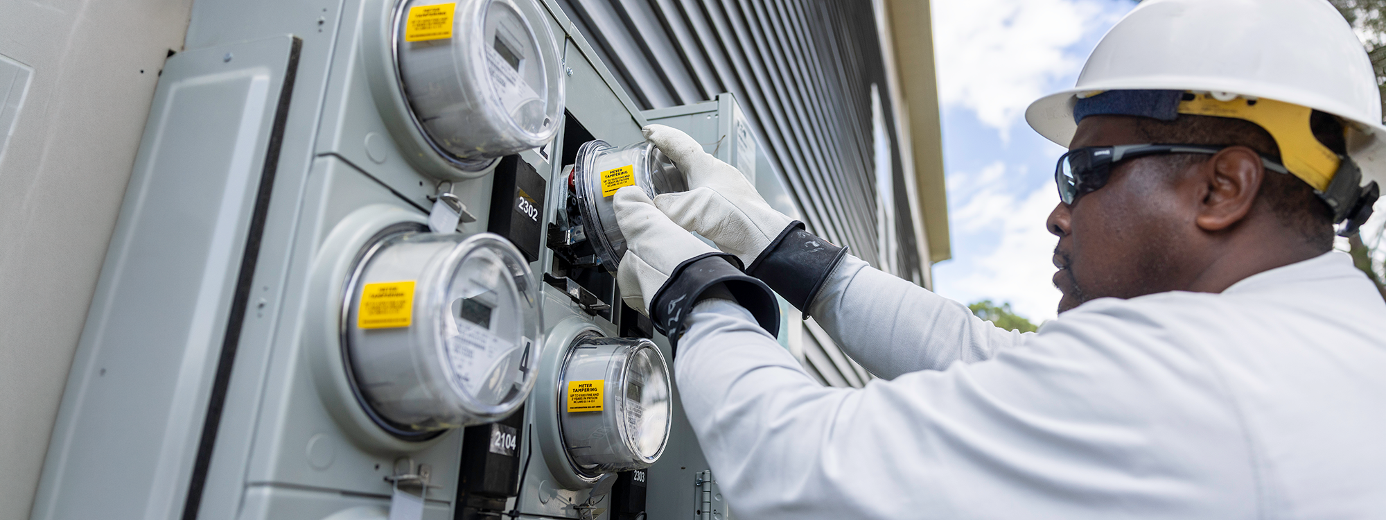 Meter technician reads meter
