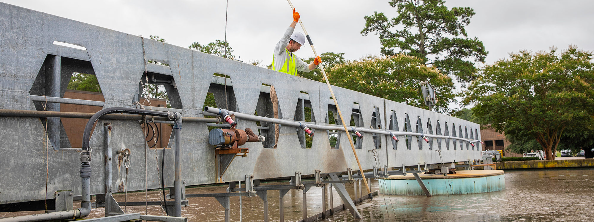 operator works at wastewater treatment plant